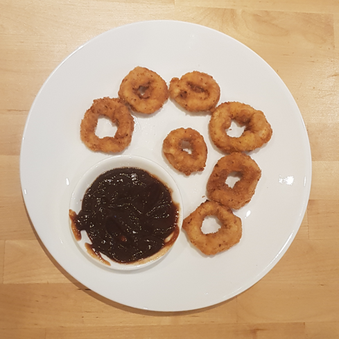 Chicken Rings on plate with sauce